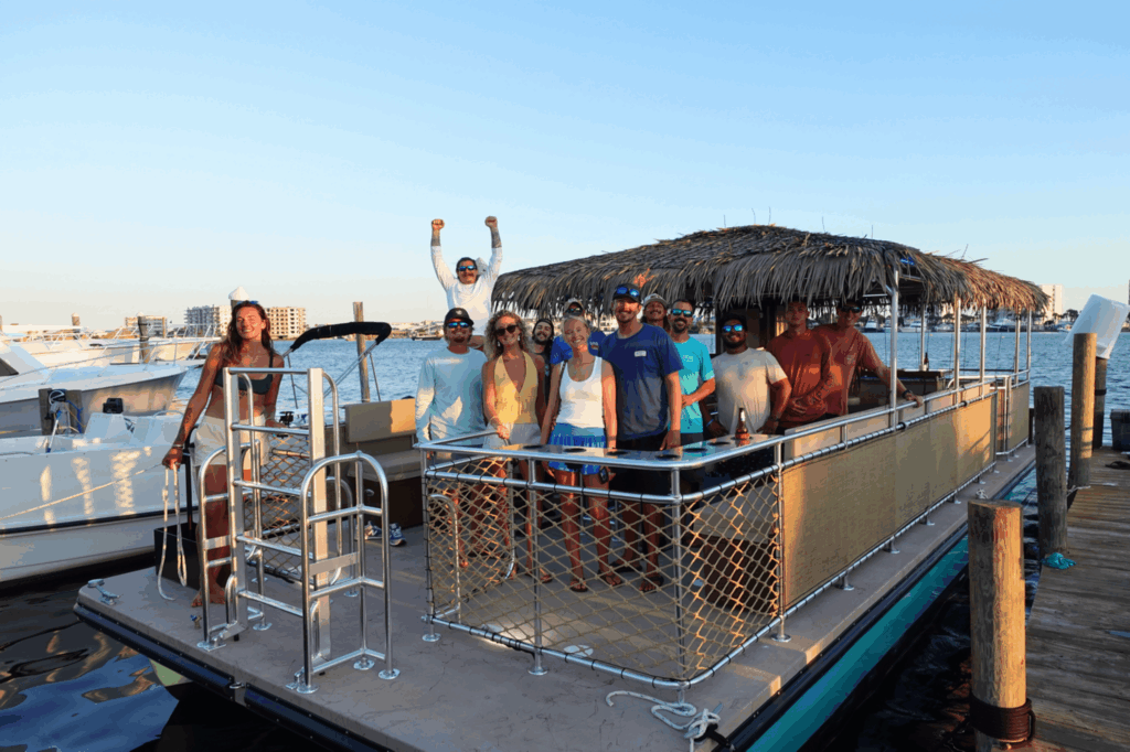 A group aboard Gilligan’s tiki boat at the dock in Destin Harbor
